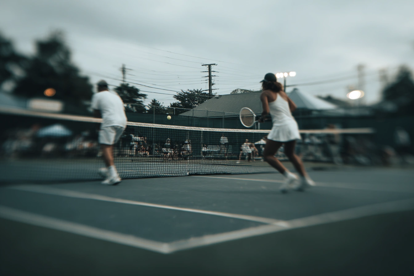 u7924323414_match_point_moment_captured_at_net_opponent_blurr_cb506351-37ff-43c1-bce6-6e7a4be337c9_2.webp