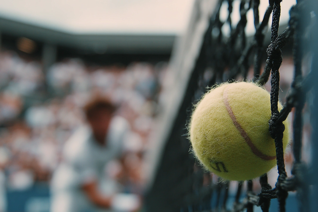u7924323414_match_point_moment_captured_at_net_opponent_blurr_3e51a915-bb40-404d-afac-a2c18437a3b8_0.webp